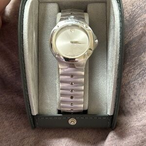 Movado SE stainless steel men’s watch. Used. In box with book and certificate.